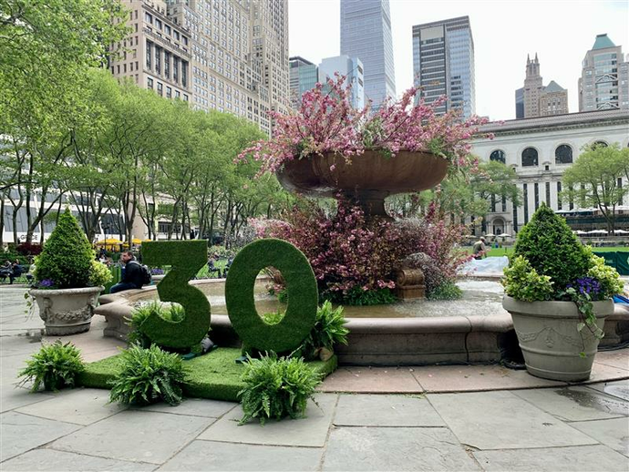 Check out photos of the Bryant Park fountain filled with flowers