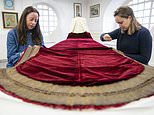 Finishing touches are made to the King’s Robe of State that was first worn by George VI